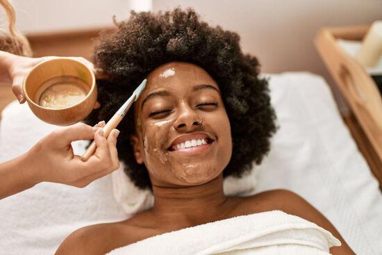 Client receiving a professional acne facial treatment