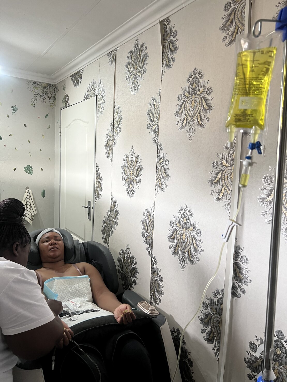 Wellness client enjoying a detox IV drip and sauna session