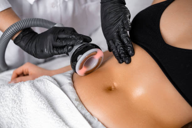 Client receiving non-invasive body contouring on abdomen
