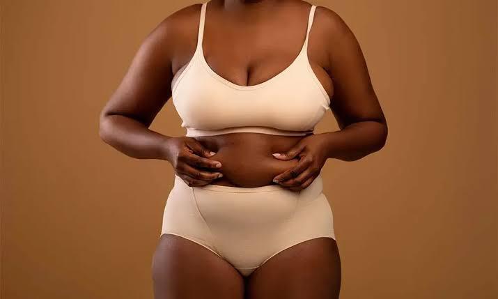New mom in a clinic discussing body contouring plan