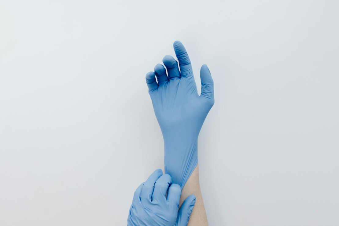 Beauty therapist preparing sterilised tools in a clean clinic
